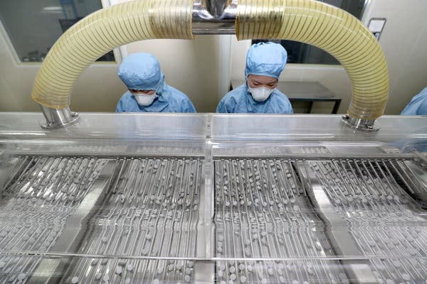 Workers in a chloroquine pill factory in Nantong, China, last month.