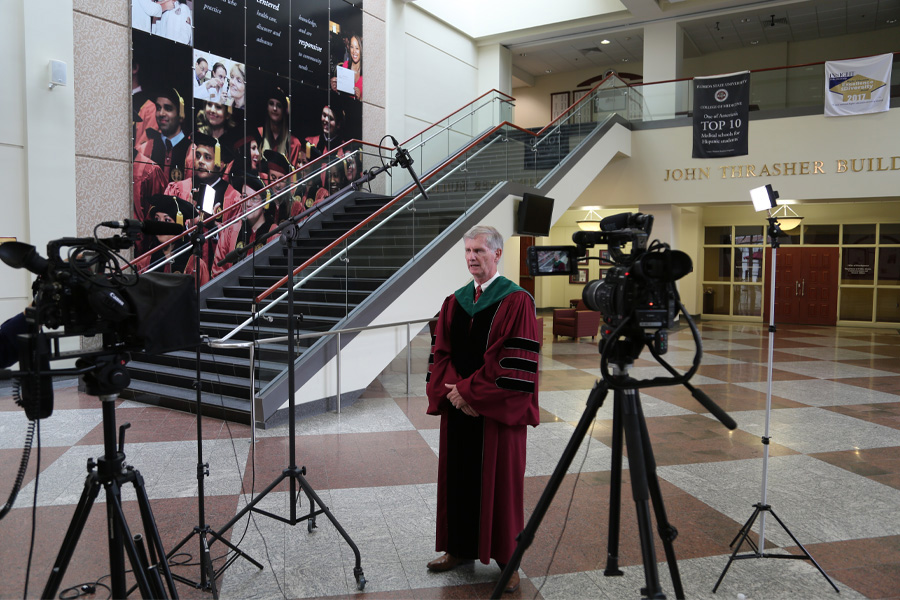College of Medicine Dean John P. Fogarty records a message for the graduating class. (Mark Bauer/College of Medicine)