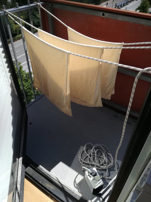 The experimental setup of towels, hanging on a balcony at the University of Copenhagen.