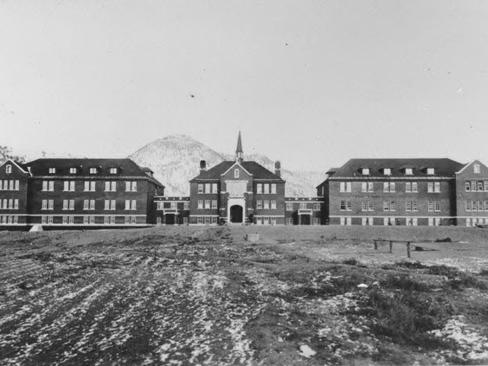 An historic photograph of the Kamloops Indian Residential School, the largest of Canada's 130 residential schools. Ground-penetrating radar has found 215 unmarked graves on the former school property.