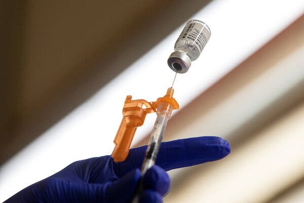 A pharmacy technician preparing a dose of the Pfizer vaccine in San Antonio.